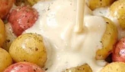 Pour evaporated milk over raw baby potatoes, together with 2 pantry staples, into slow cooker for a hearty family supper that disappears faster than a