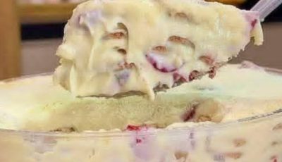 Layered dessert with cream, biscuits and fruits